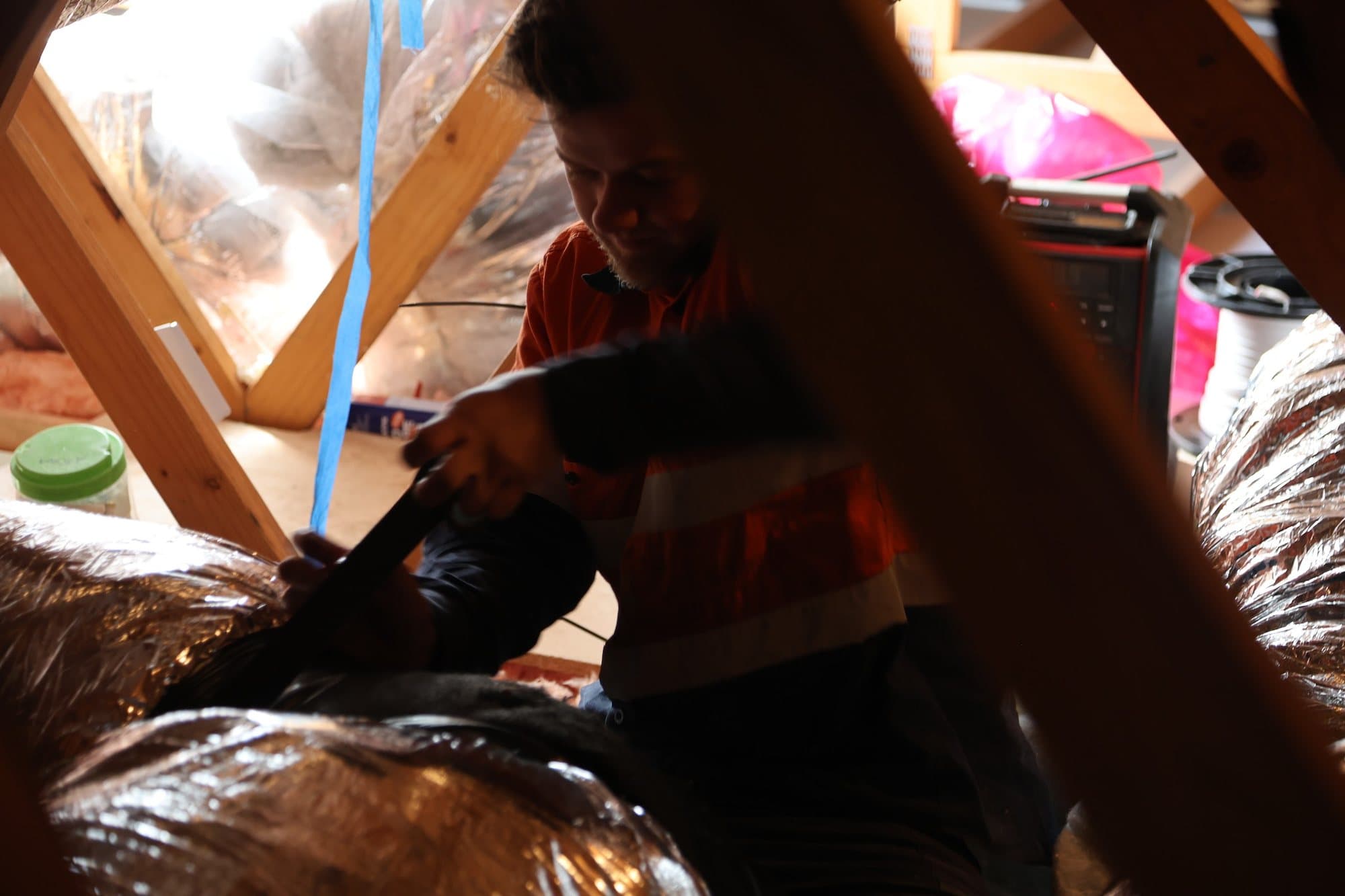 Ducting strapped and sealed in the roof