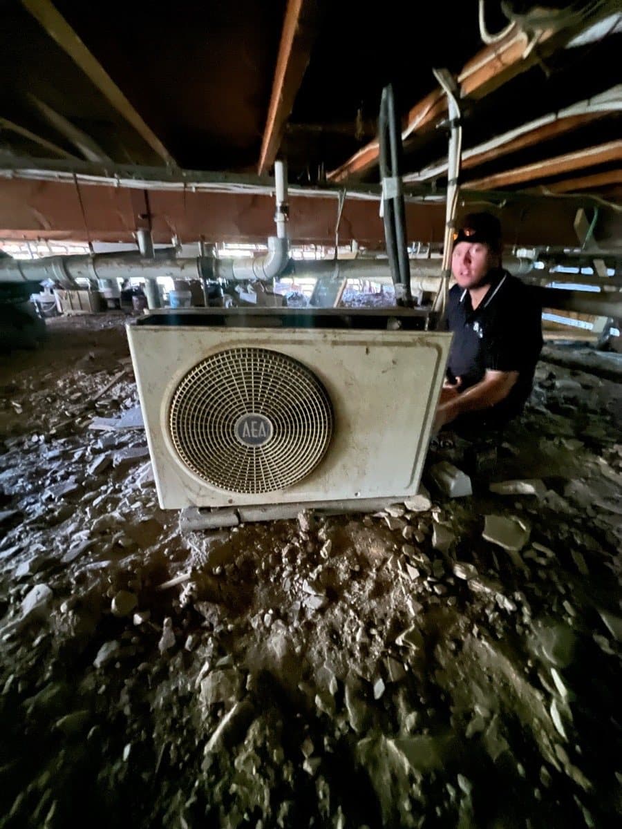Condenser set on blocks in the crawlspace