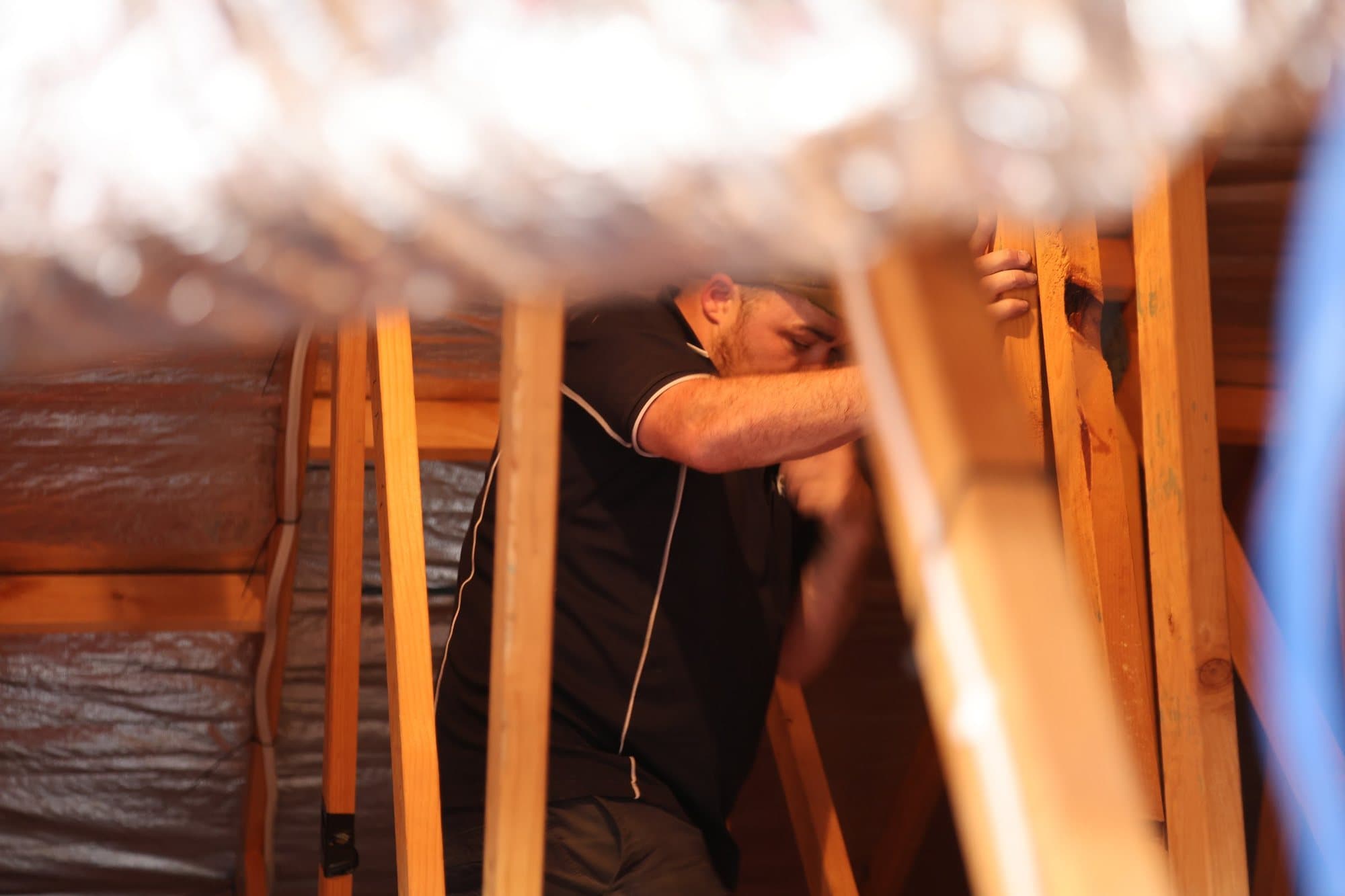 Fitting ducting among the roof trusses